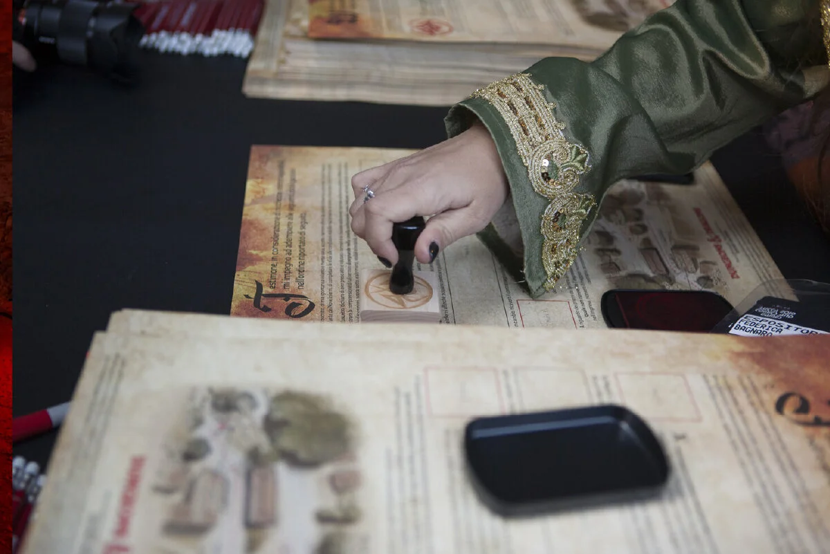 Cosplayer stamping a quest scroll